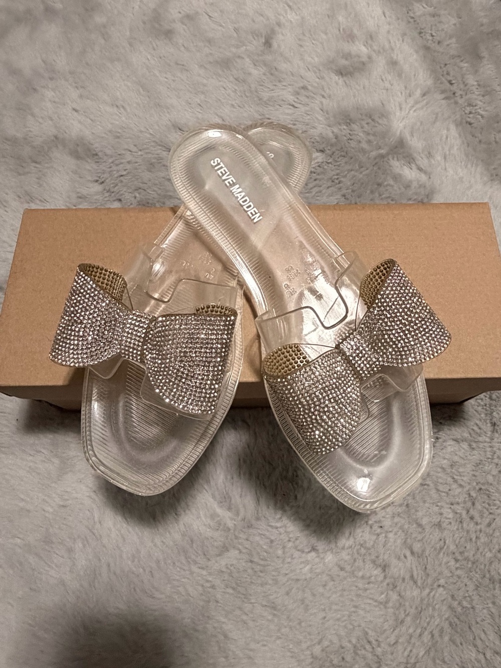 Steve Madden Clear Slide Sandals with Rhinestone Bow